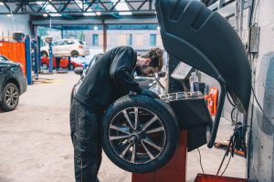 Mr Tyre mechanic changing a tyre
