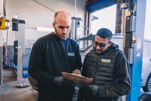 Mr Tyre Derby staff going through MOT checklist.
