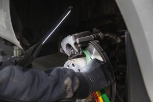 Mr Tyre Peterborough checking the thickness of the brake pad