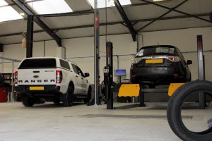 Mr Tyre Bloxwich with vehicles on inspection ramps