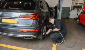 Mechanic checking tyre pressure at Mr Tyre Rochdale.